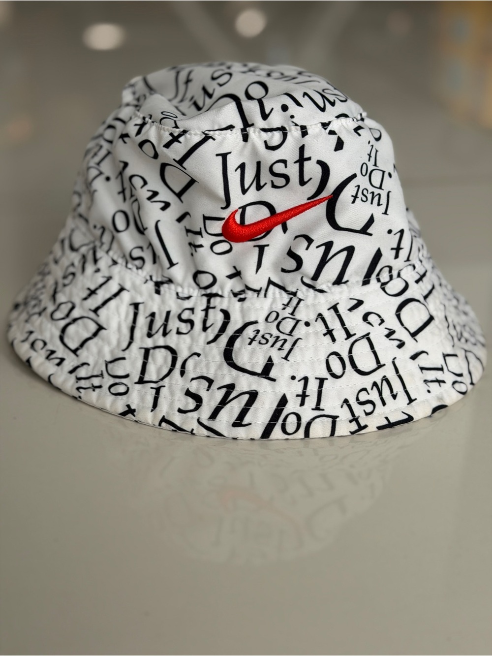 Nike Kids White Bucket Hat with Black Script and Red Swoosh